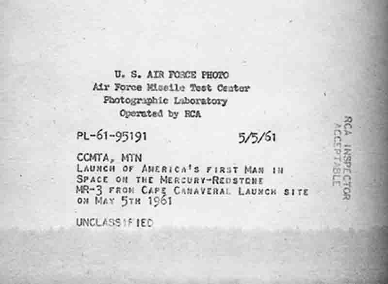 A black and white depiction of a NASA photograph verso with visible text, showcasing the written information in a vintage aesthetic.